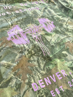 Angled detail of the skeleton-hand barbell graphic on the back
