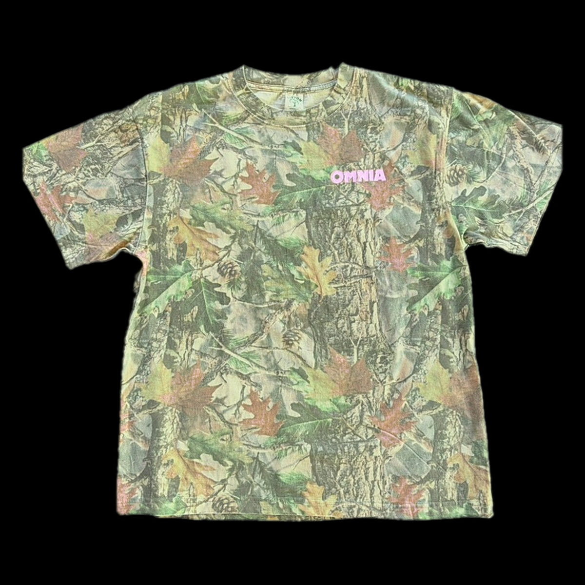 Omnia Shop Tee in vintage faded camo, front with pink OMNIA chest print